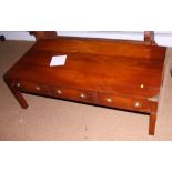 A cherry and brass inlaid campaign style coffee table, fitted three drawers, 48" wide