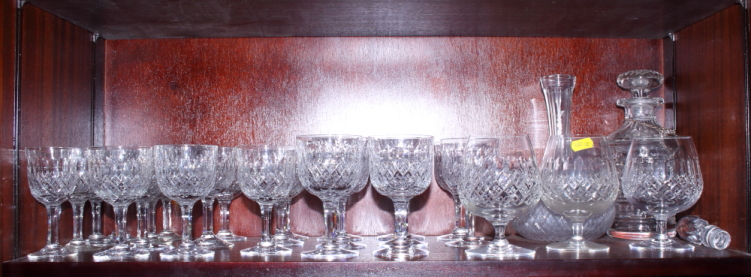 A web cut glass table service for six, together with a decanter, two brandy glasses and one other