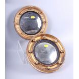 Two circular convex wall mirrors, in gilt ball decorated frames, 9" dia overall