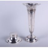 A silver capstan inkwell and a silver trumpet vase