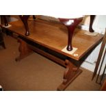 An oak plank top refectory table, on panel end supports, 28" x 65"
