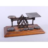 A late 19th century brass letter balance with weights