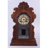 An Ansonia Clock Company oak cased mantel clock, 23" high