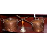 Two copper saucepans and covers, a brass dinner gong, on wall hung mount with beater, and a brass