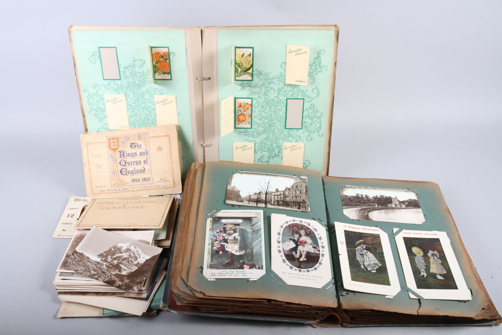 An Edwardian postcard album, a number of loose postcards, mostly topographical, and a part filled