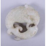 A Chinese pale celadon jade carving of a fish and a dragon, 2" wide