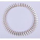 A Georg Jensen silver "Dancing Ladies" necklace, No 115, designed by Bent Gabrielsen, 18" long