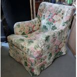 A deep seat armchair with loose cushion, upholstered in a floral linen loose cover