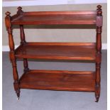 A Victorian mahogany three-tier buffet, on castors