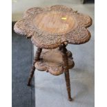 A Kashmir carved Shi Shan hardwood hexafoil top two-tier occasional table, 18" dia