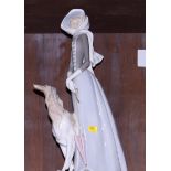 A Lladro figure of a lady with a borzoi, 16" high