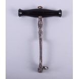 A dentist's 19th century steel and ebony tooth key, 6" long