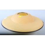 A 1960s "flying saucer" lamp shade, in yellow and amber, 15" dia