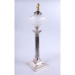 A plated Corinthian column table lamp with cut glass reservoir, 22" high (now converted to