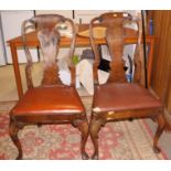 A set of five walnut standard dining chairs of Queen Anne design with drop-in seats, on cabriole