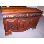A late 19th century walnut sideboard, fitted two convex fronted frieze drawers, drawer and three