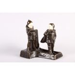 Peter Tereszczuk: an early 20th century bronze and ivory match box holder with two Pierrot