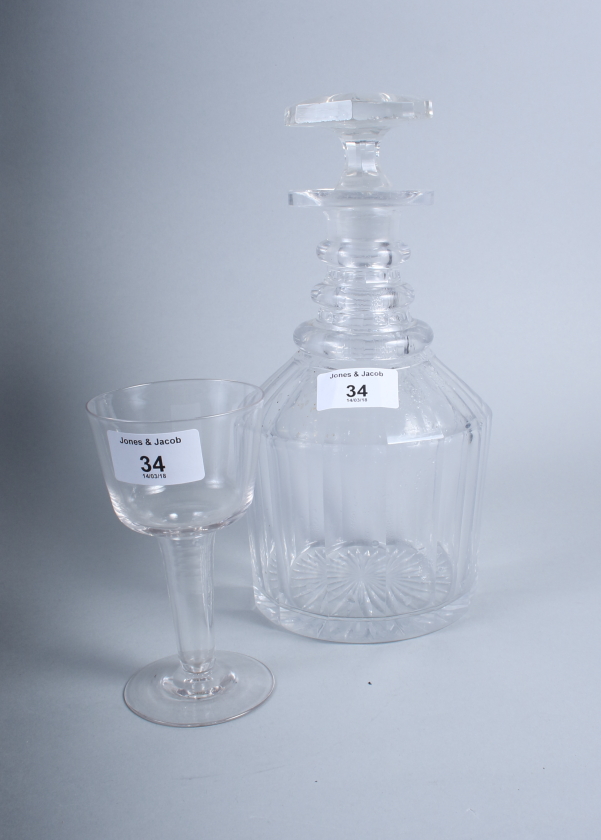 A 19th century hollow stem glass and a three-ring necked cut glass decanter and stopper