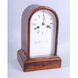 A 19th century rosewood arch top mantel clock with white enamel dial by Henry Marc Paris, 8 1/2"