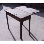 A 19th century figured mahogany fold-over top card table, on chamfered supports, 33" wide