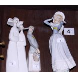 Two Lladro figures, nuns, 14" high, and two smaller figures of women
