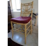 A cream painted faux bamboo framed bedroom chair