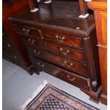 A George III mahogany chest of two short and three long graduated drawers with original brass