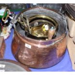 A Middle Eastern copper bucket, a brass coal scuttle, a number of fire implements and other brass