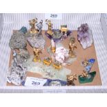 A collection of mineral samples, with silvered and gilt figures of miners and gold panners, and