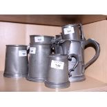 A collection of 19th century pewter tankards and jugs, various