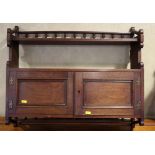 A late 19th century mahogany wall cupboard with spindle gallery over and one shelf, 25" wide