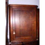 A Georgian oak corner hanging cupboard enclosed panel door, 35" wide