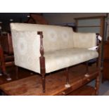 A George III mahogany framed two-seat settee, upholstered in a Colefax and Fowler brocade, on