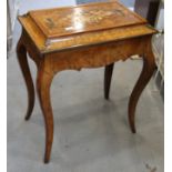 A 19th century figured walnut, Kingwood banded and marquetry work table, with lift-up cover and gilt