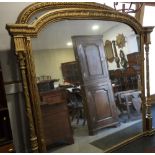 A Victorian arch top overmantel mirror, in gilt frame with pilasters, 74" x 71"
