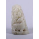 A Chinese pale celadon jade carving with a deer, 2 1/2" high