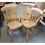 A set of four Windsor lath back kitchen chairs with panel seats, on turned supports
