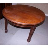 An early 20th century mahogany oval extending dining table, on square supports decorated blind