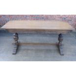 An oak "Gothic" refectory style dining table, top 36" x 72", a set of six oak standard dining chairs