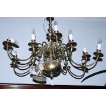 A Dutch design twelve-branch brass centre light fitting with scroll arms, 36" dia, and a similar,