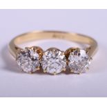 An 18ct gold three stone diamond ring, each stone approx 0.5ct, ring size O