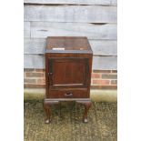 A polished as walnut bedside cabinet enclosed panel door over one drawer, on cabriole supports