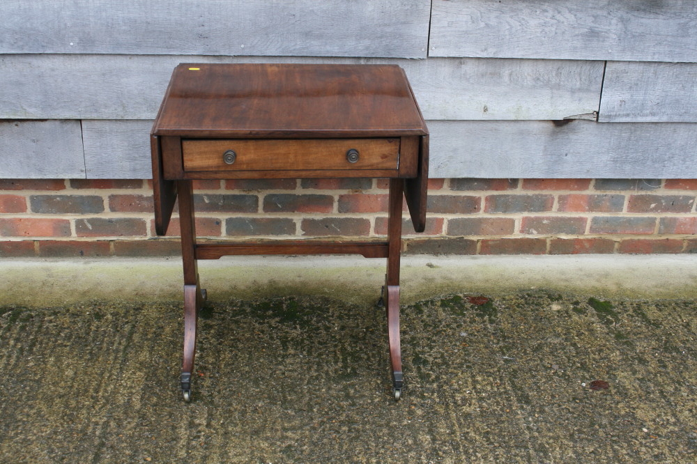 A 19th century mahogany and ebony strung "sofa" table, fitted one drawer on panel end, on splay