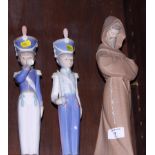 A pair of Lladro figures, boy soldiers, 13" high, and a figure of a monk