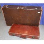 A leather suitcase and a leather edged suitcase