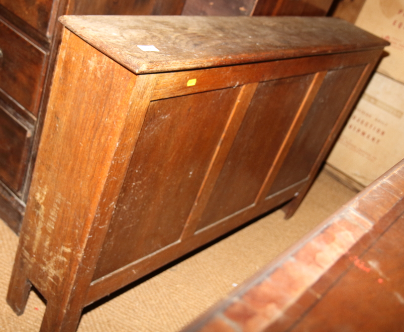 An oak vestment chest with triple panel front, 48" wide
