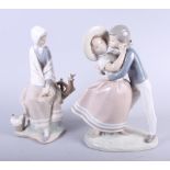 Three Lladro figures, girl resisting a kiss, woman with a bird on a fence and mother and daughter