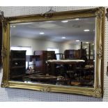 A gilt panel wall mirror with bevelled plate, 23 1/2" x 35 1/2"