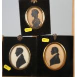 Two early 19th century portrait silhouettes, unknown gentlemen, and a similar companion portrait