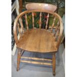 An ash and elm spindle back elbow chair